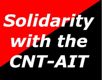 'Solidarity with CNT-AIT' on red and black flag.